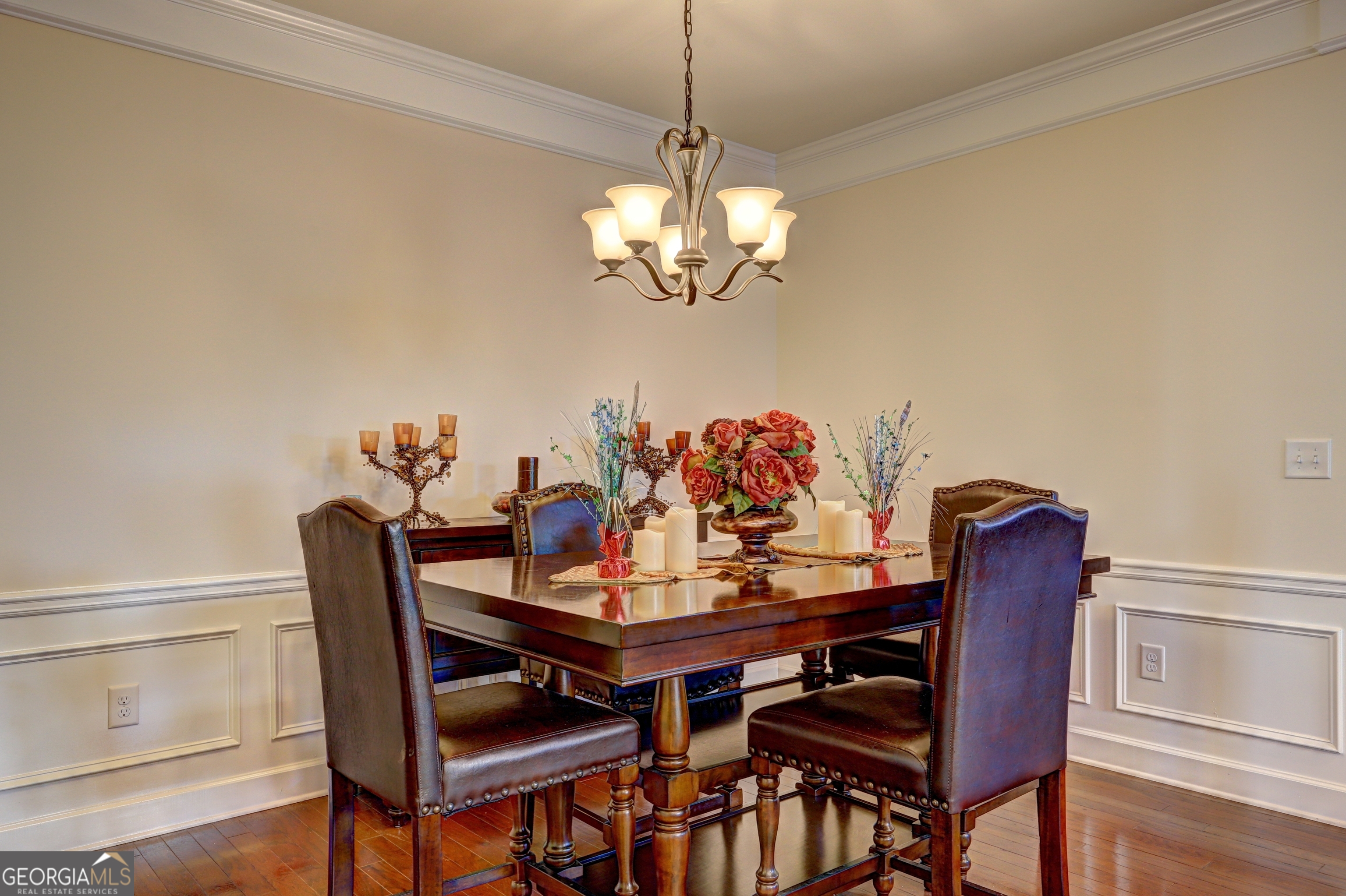 757 Firefly Court Griffin, GA 30223 - Photo 15 of 31 a dining room with furniture a chandelier and wooden floor