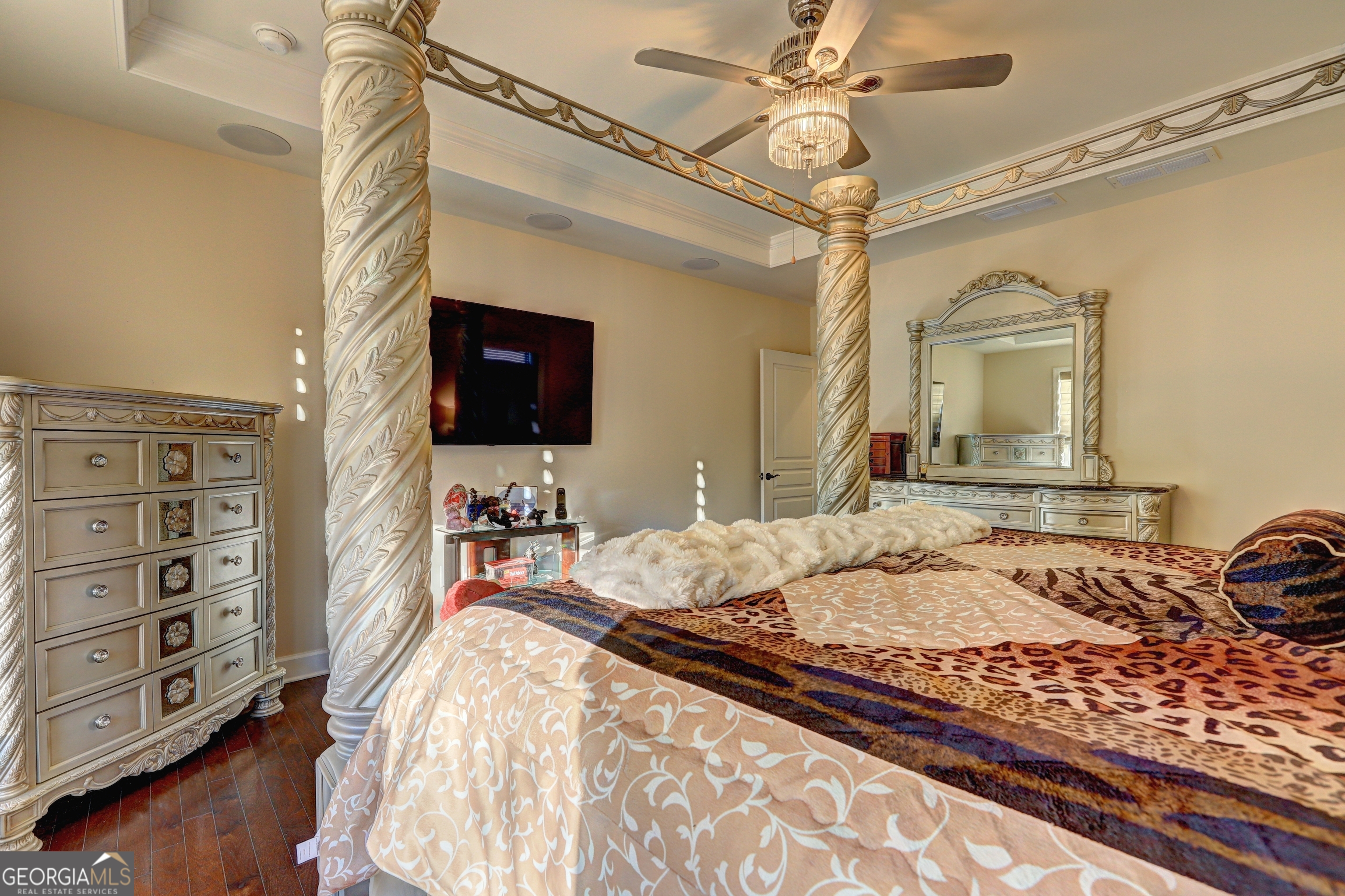 757 Firefly Court Griffin, GA 30223 - Photo 19 of 31 a bedroom with a bed and a flat tv screen on dresser