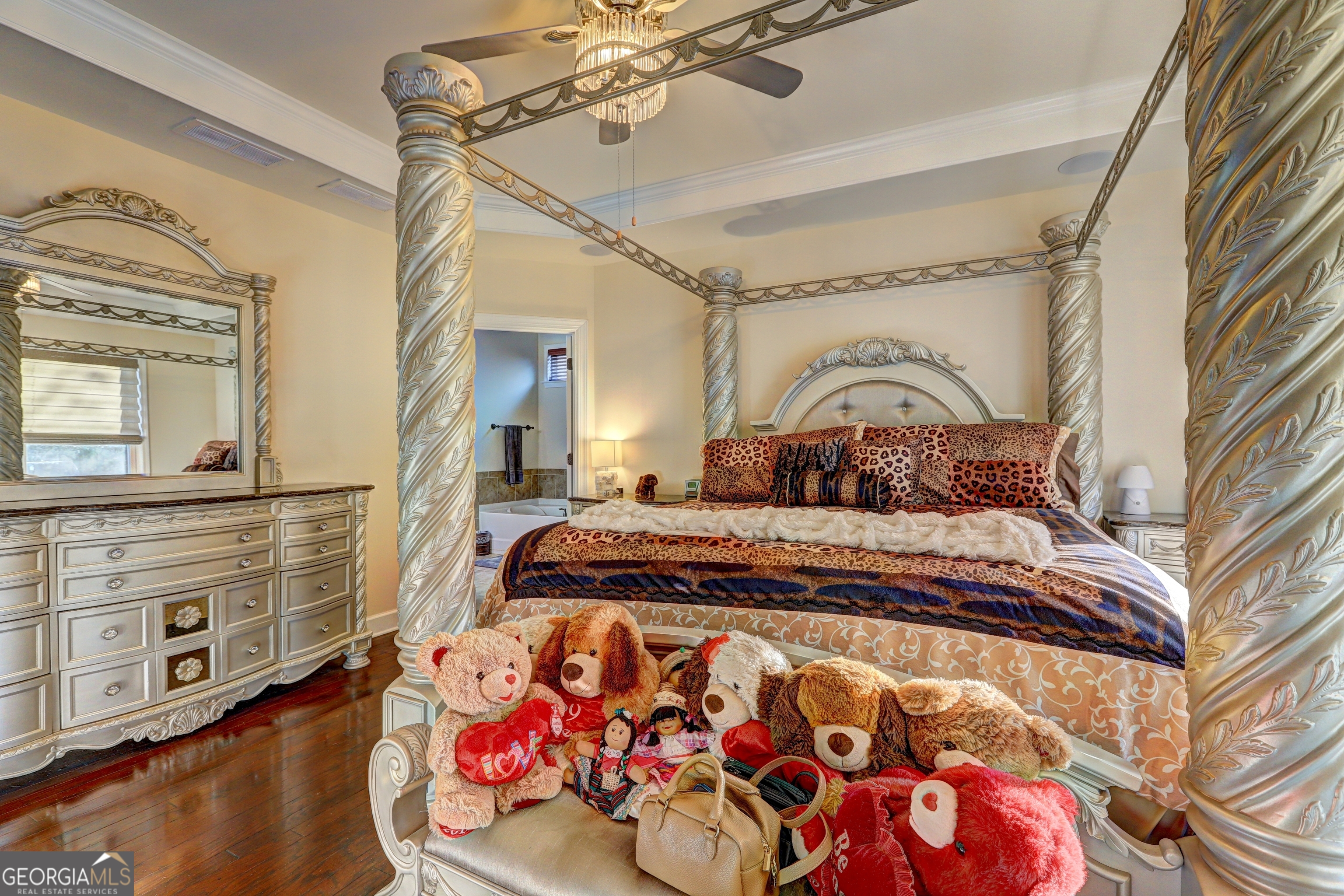 757 Firefly Court Griffin, GA 30223 - Photo 20 of 31 a bedroom with a bed and wooden floor