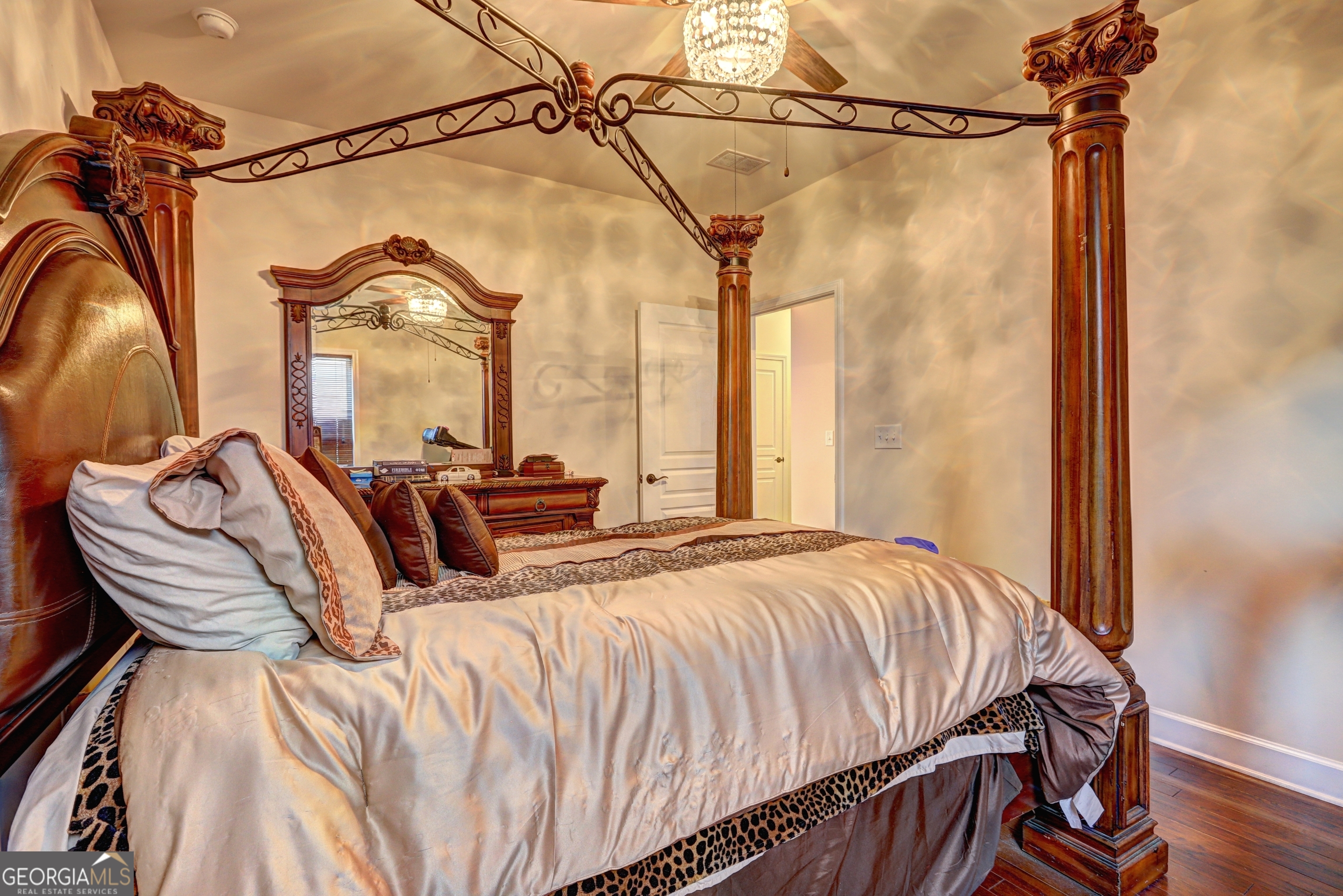 757 Firefly Court Griffin, GA 30223 - Photo 26 of 31 a bedroom with a bed and a mirror