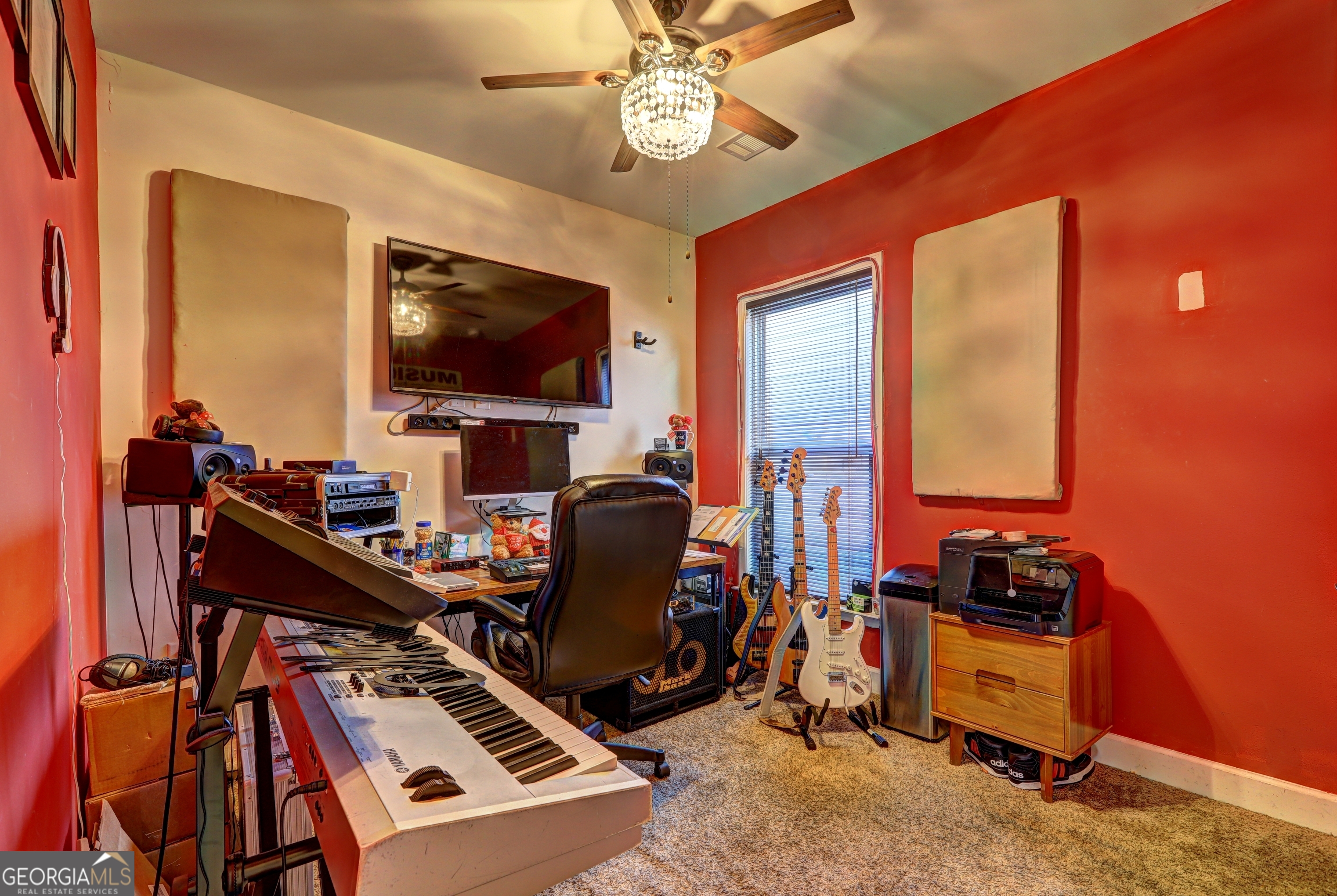 757 Firefly Court Griffin, GA 30223 - Photo 27 of 31 a room with furniture and a flat screen tv