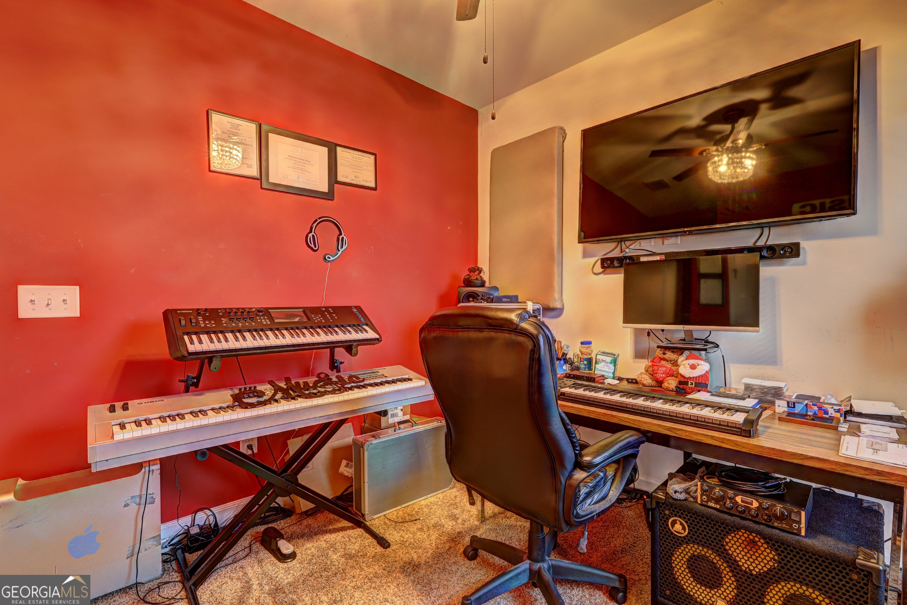 757 Firefly Court Griffin, GA 30223 - Photo 28 of 31 a work room with furniture and flat screen tv
