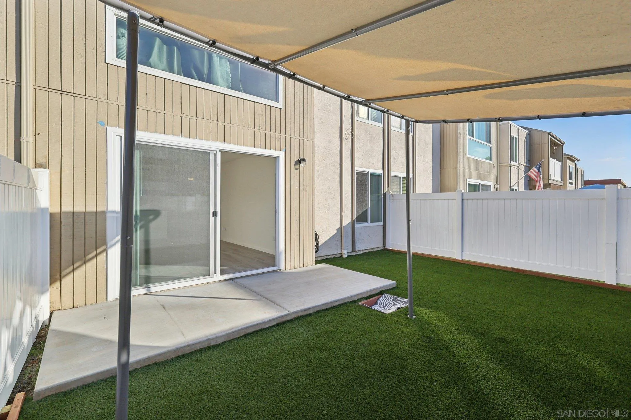 8034 Linda Vista Road, Unit 1S San Diego, CA 92111 - Photo 22 of 33 a view of porch with a yard