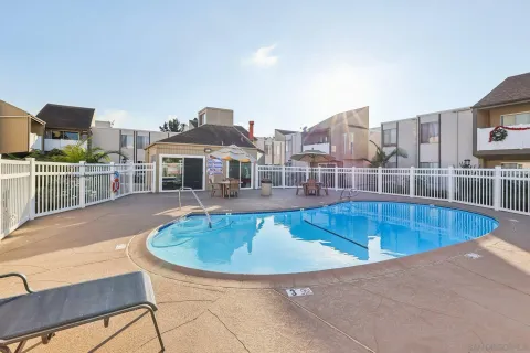 a view of a swimming pool with a lounge chair