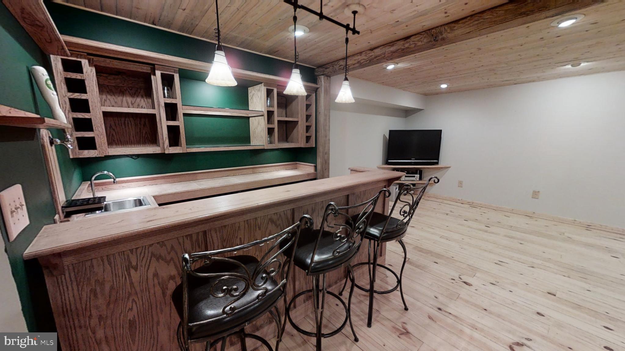 295 Douglas Road Mineral, VA 23117 - Photo 22 of 37 Wet bar with wine cooler, refrigerator & beer tap