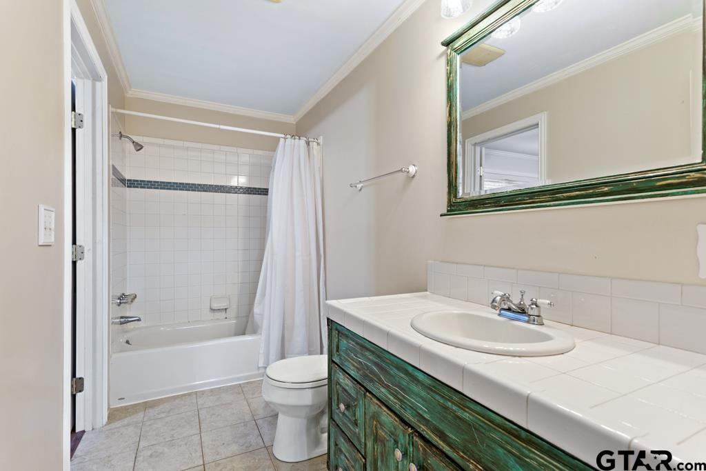 448 North Hill Road Tyler, TX 75706 - Photo 22 of 30 a bathroom with a sink and a mirror