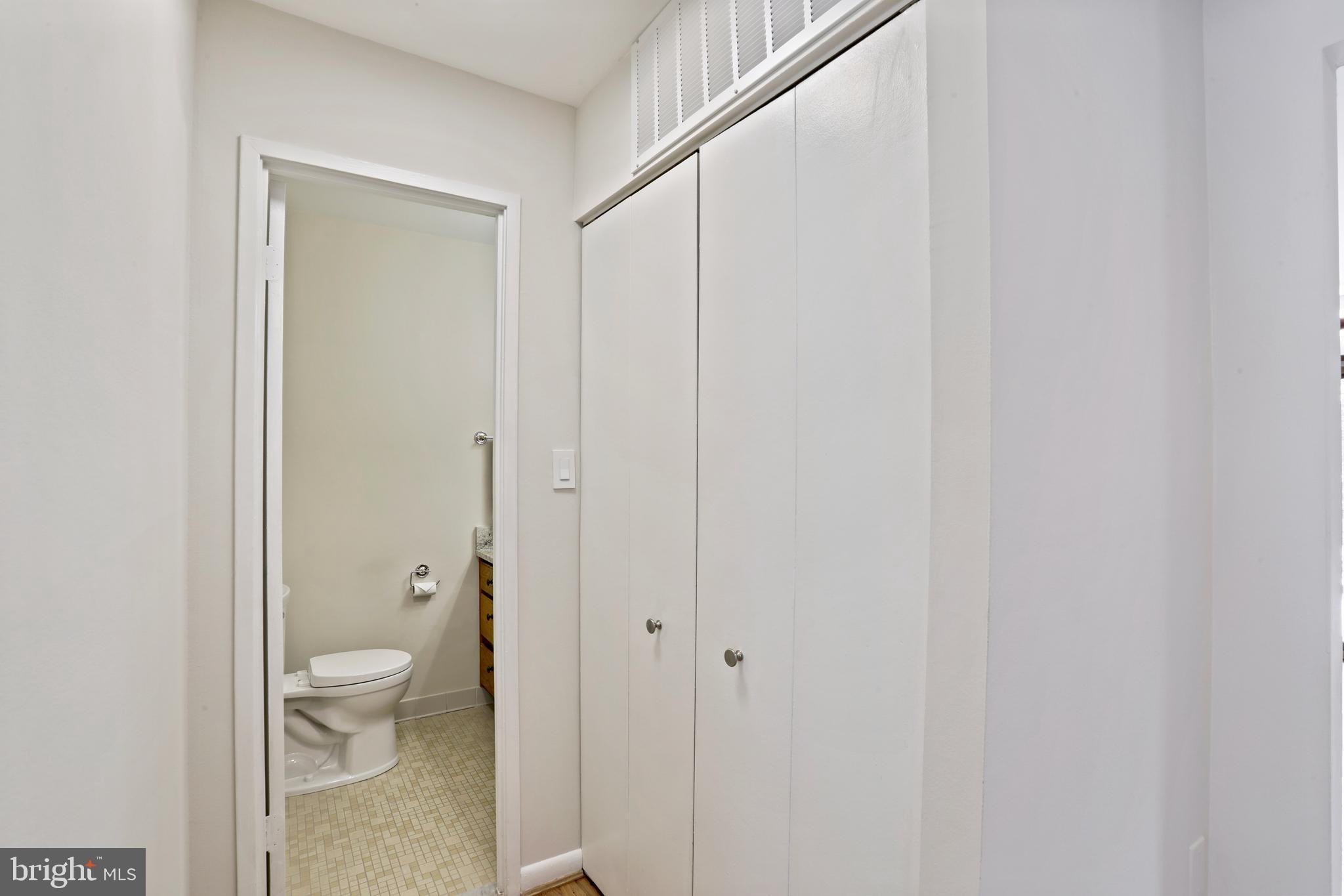 1644 Wainwright Drive Reston, VA 20190 - Photo 13 of 34 Closet & Main Level Powder Room