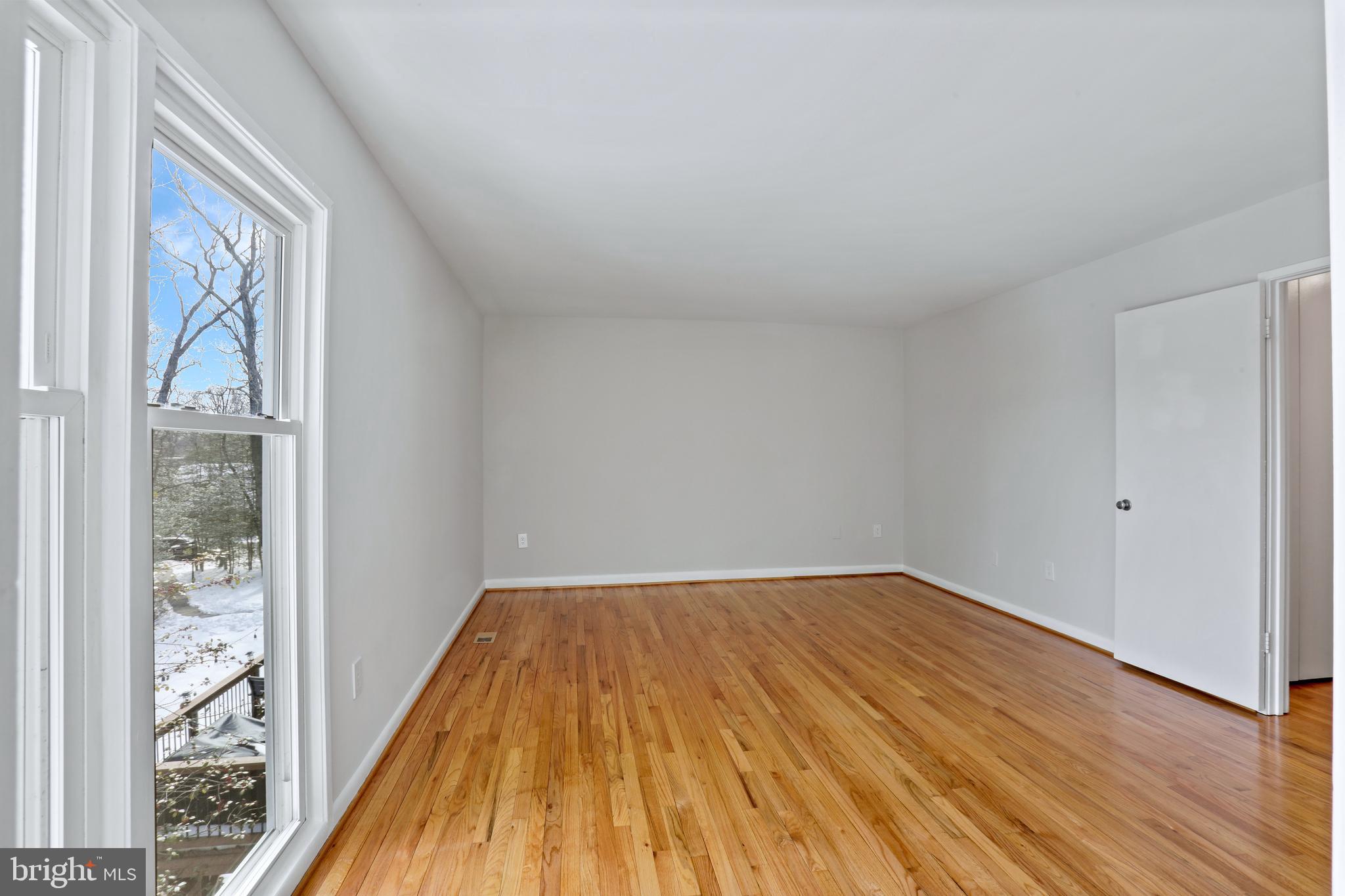 1644 Wainwright Drive Reston, VA 20190 - Photo 18 of 38 a view of a room with wooden floor and a window