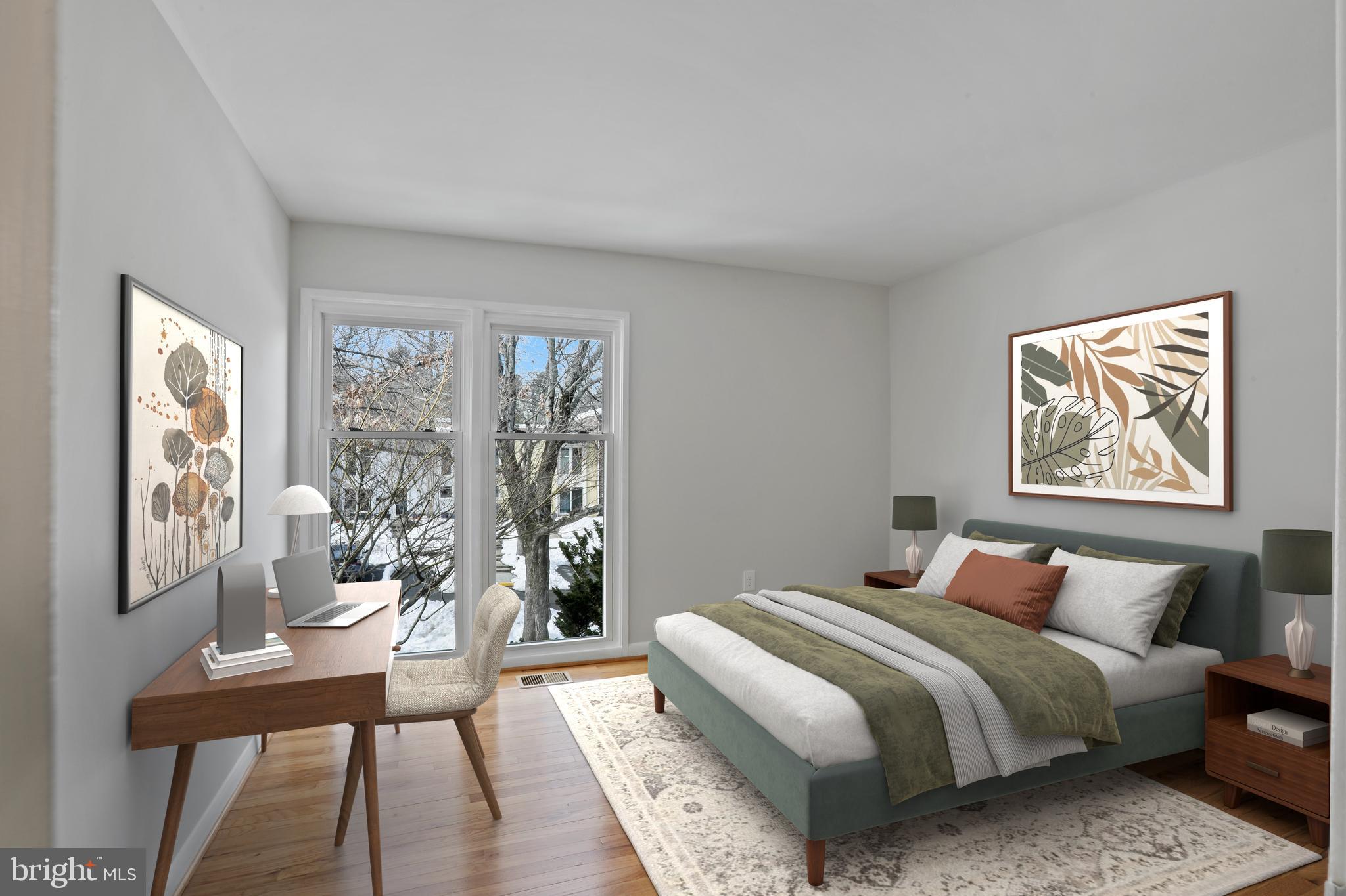 1644 Wainwright Drive Reston, VA 20190 - Photo 22 of 38 a bedroom with a large bed and a wooden floor