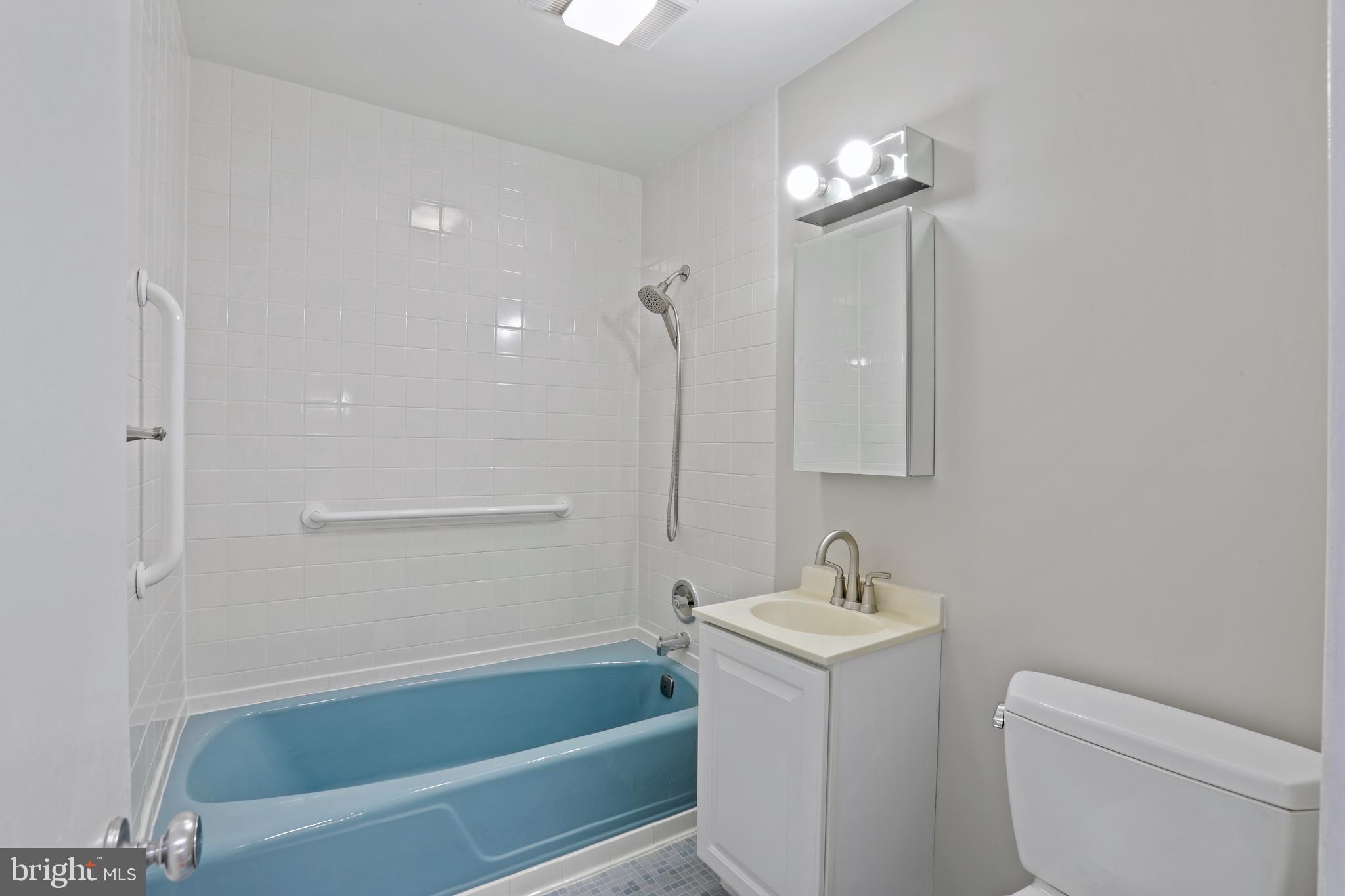 1644 Wainwright Drive Reston, VA 20190 - Photo 24 of 38 a bathroom with a sink a toilet and shower