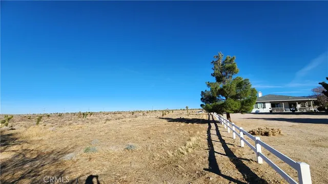 a view of a golf course with a building