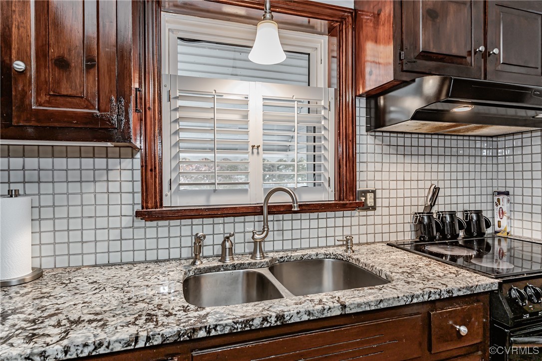 8316 Colebrook Road Richmond, VA 23227 - Photo 8 of 47 Kitchen featuring light stone counters, backsplash