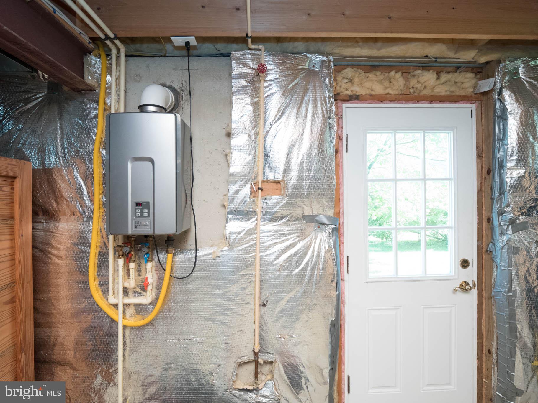 6075 Hanover Road Hanover, MD 21076 - Photo 46 of 54 Tankless Gas Hot Water. Walk out to side Yard