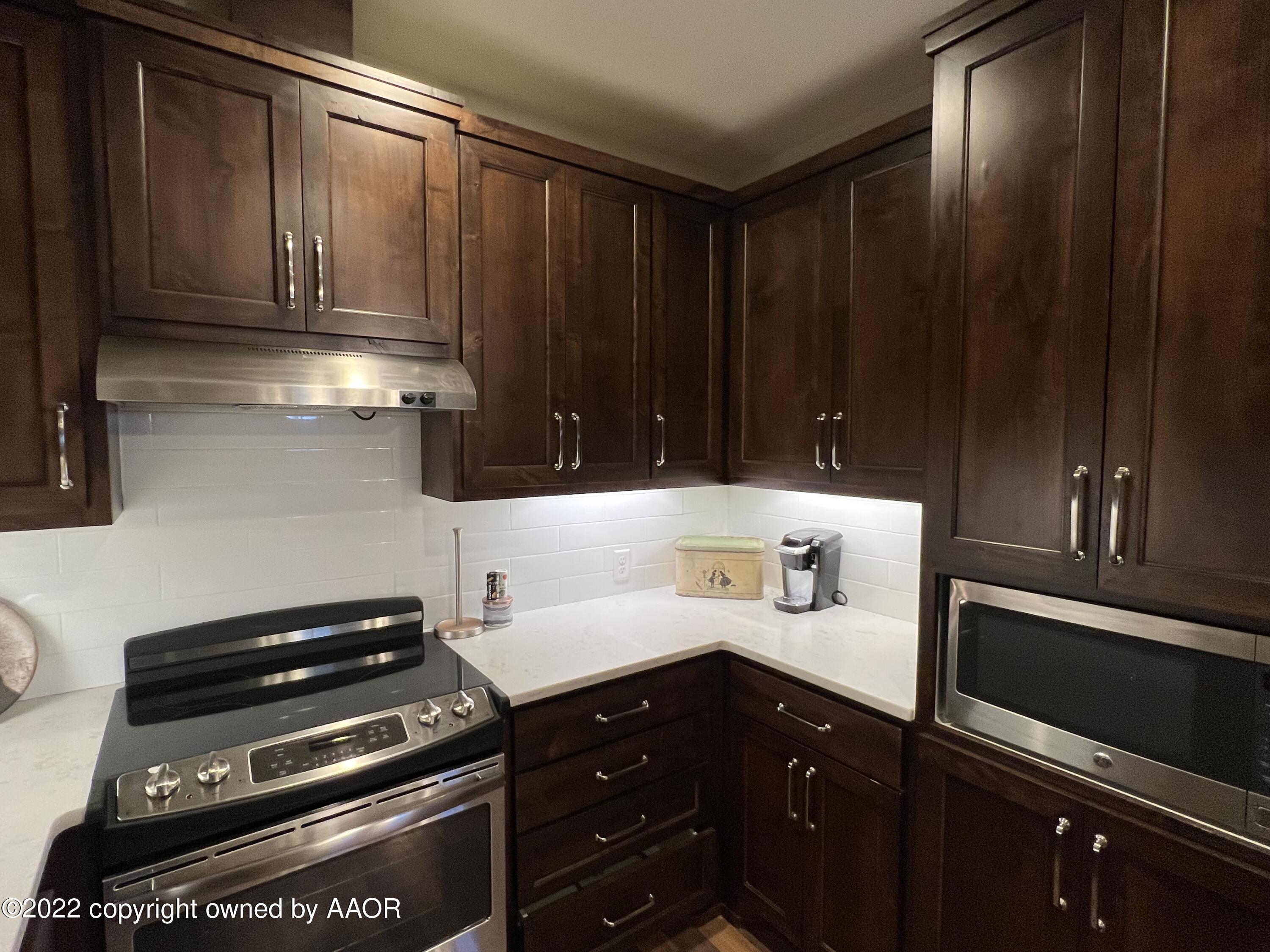 Southeast 10th Amarillo, TX 79101 - Photo 3 of 10 a kitchen with a sink and cabinets