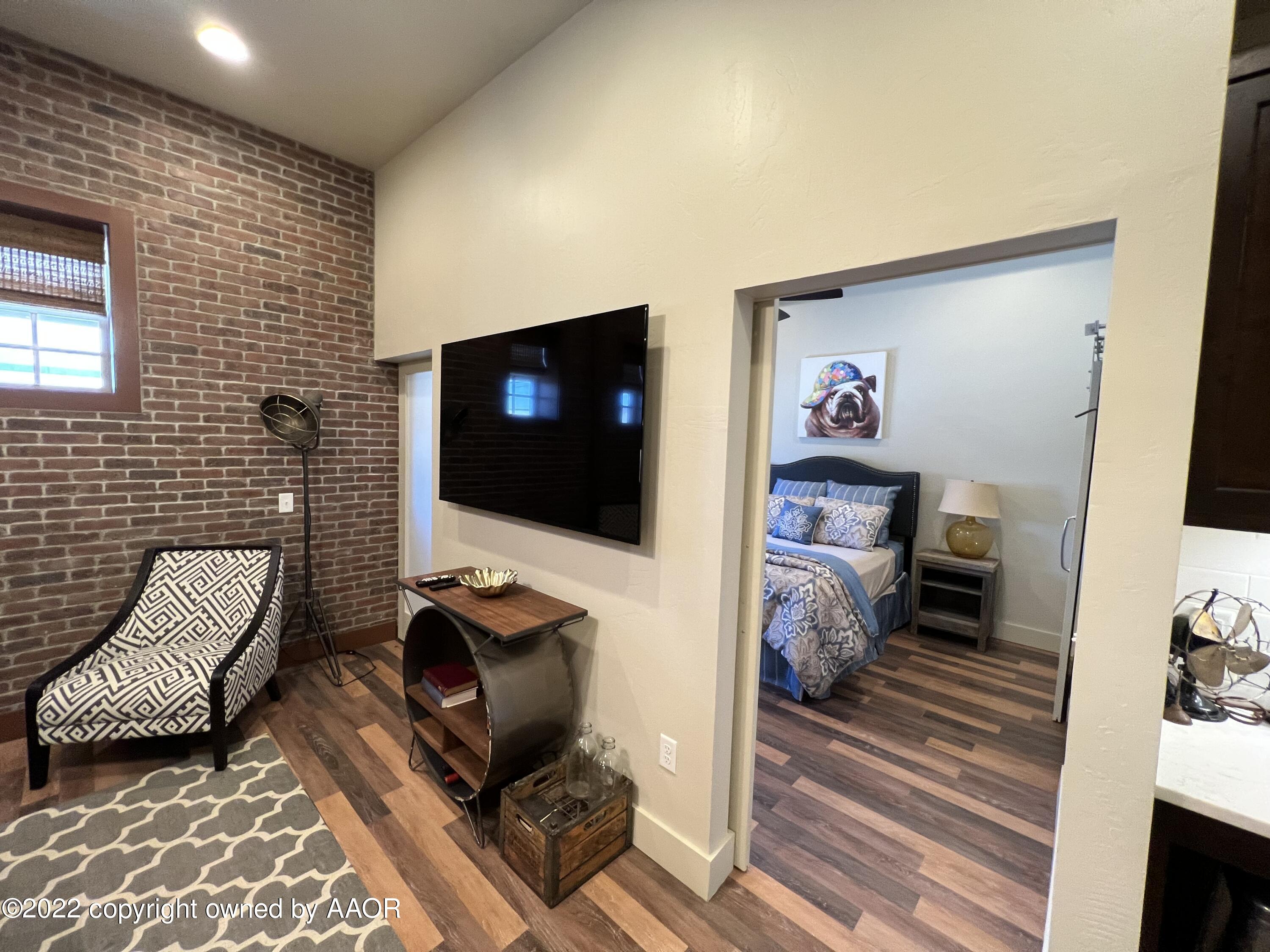 Southeast 10th Amarillo, TX 79101 - Photo 9 of 10 a living room with furniture and a flat screen tv
