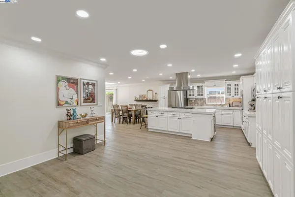 a view of kitchen with cabinets and wooden floor