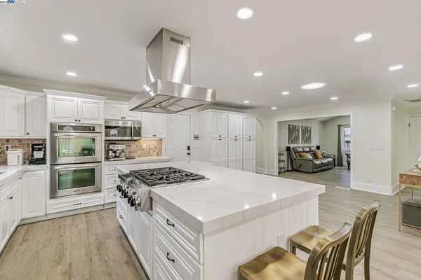 a kitchen with stainless steel appliances a refrigerator and a sink