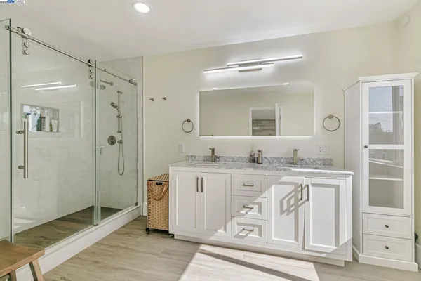 a bathroom with a bathtub and shower