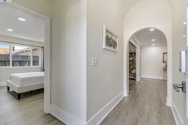 a view of a bedroom with furniture and window