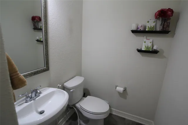 a view of hall way with furniture