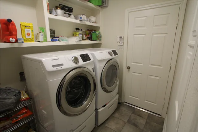 a view of a backyard with plants and a patio
