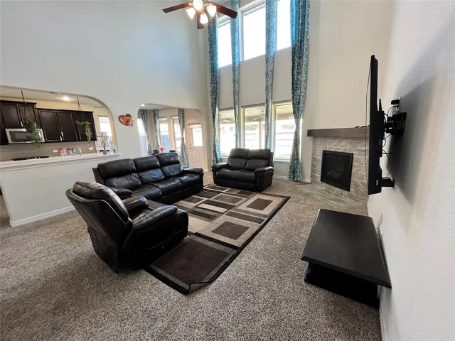 a living room with furniture and a fireplace