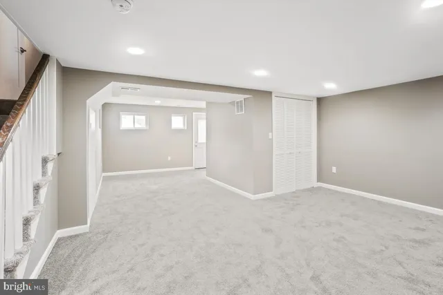 a view of an empty room and a window