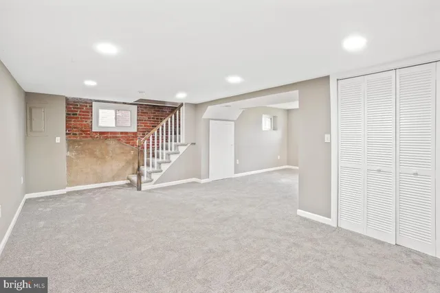 a view of an empty room with stairs