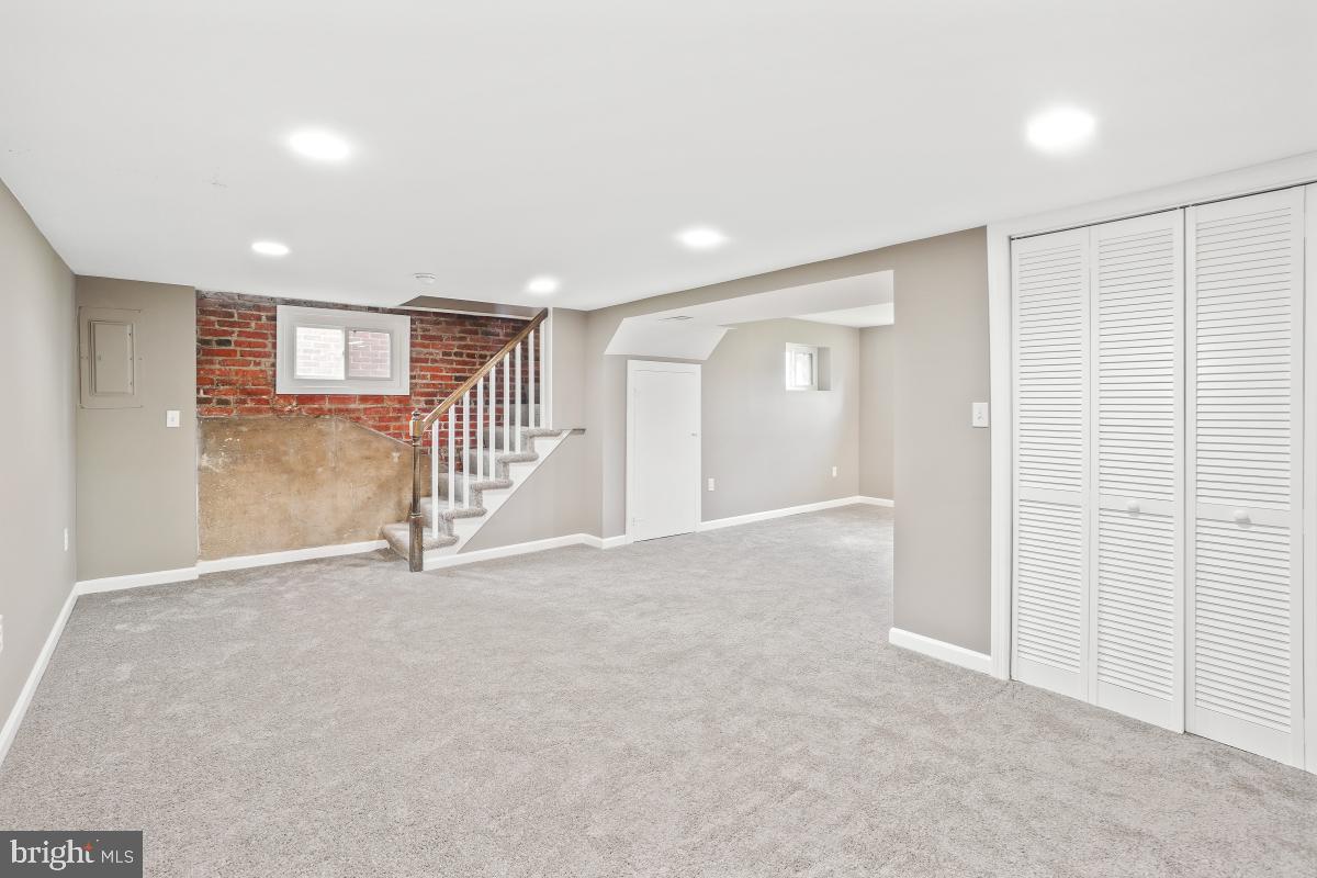 2615 Otis Street Northeast Washington, DC 20018 - Photo 19 of 45 a view of an empty room with stairs