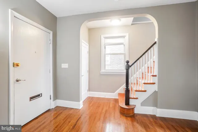 a view of entryway with wooden floor