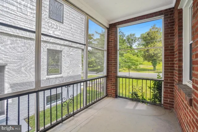 a view of a porch with a floor to ceiling window