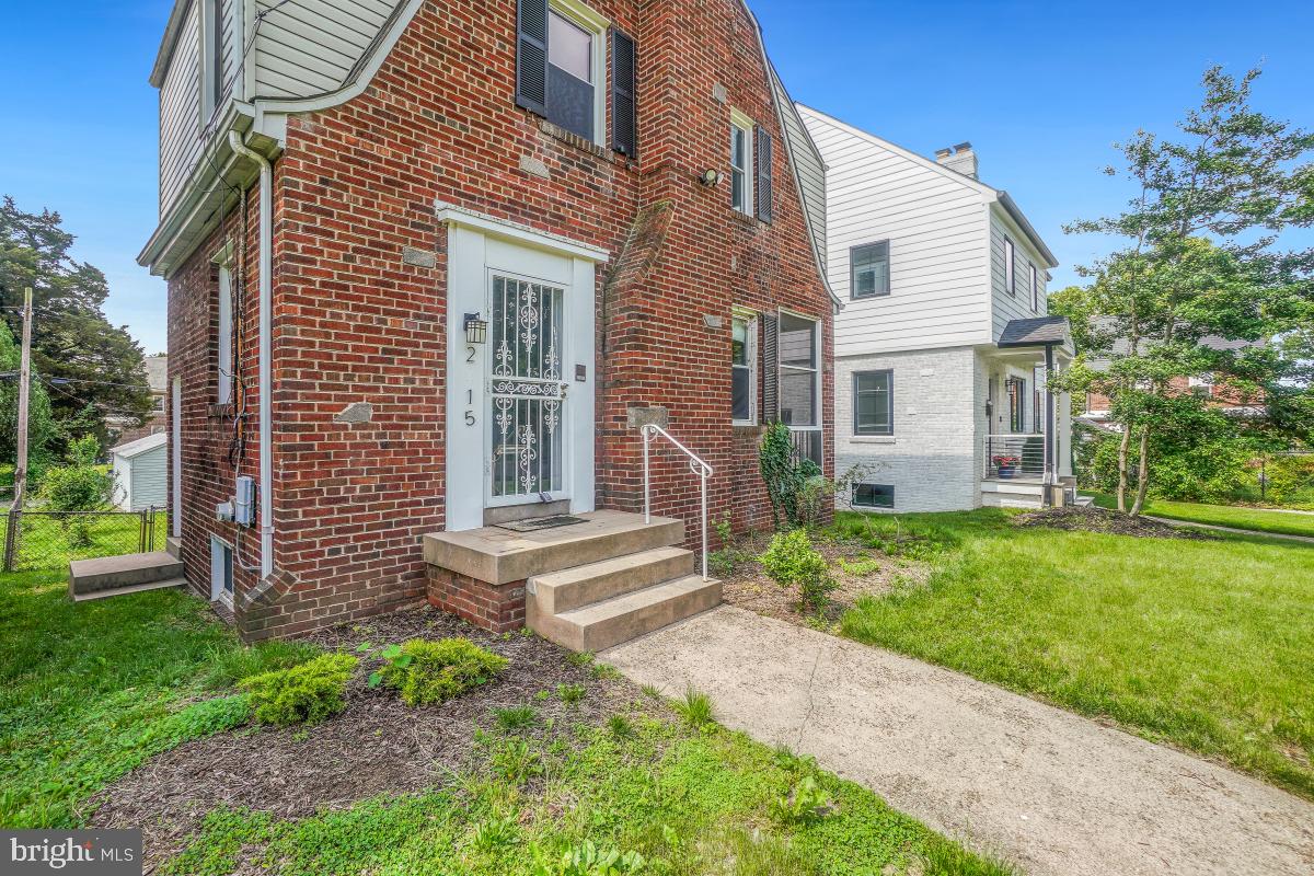 2615 Otis Street Northeast Washington, DC 20018 - Photo 4 of 45 a front view of a house with a yard