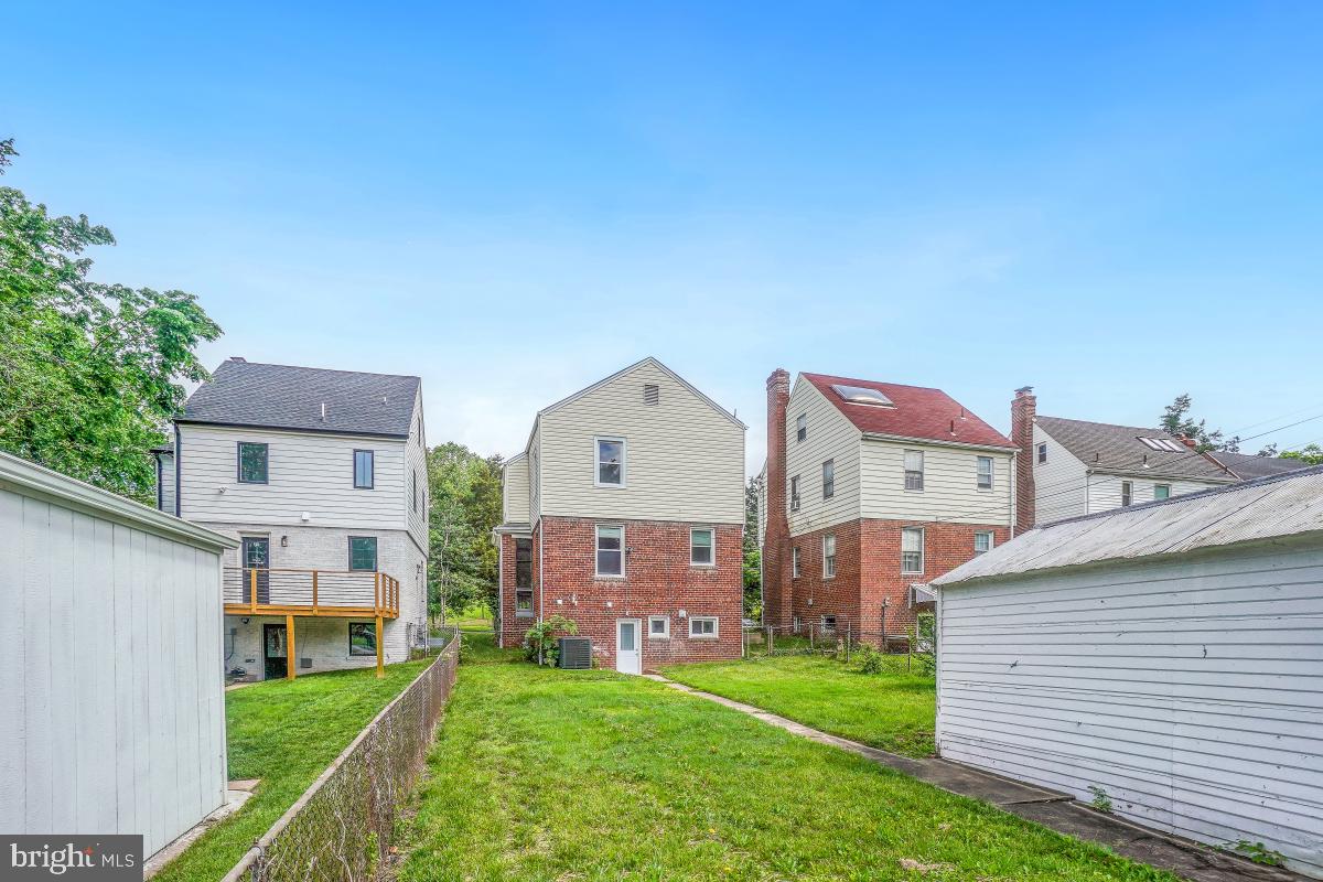 2615 Otis Street Northeast Washington, DC 20018 - Photo 44 of 45 a front view of a house with a yard
