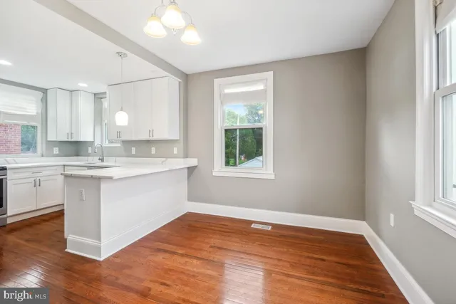 a view of kitchen with wooden floor and electronic window