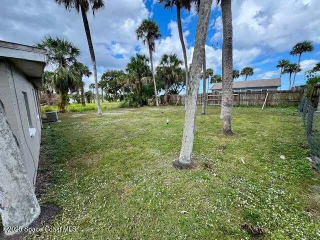 a backyard of a house with lots of green space