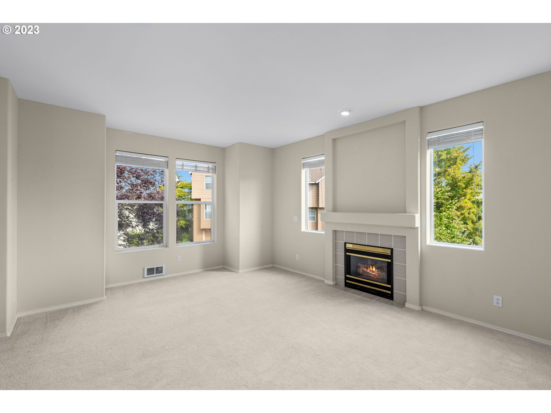 15530 Southwest Peridot Way Beaverton, OR 97007 - Photo 11 of 31 a view of empty room with a fireplace and a window