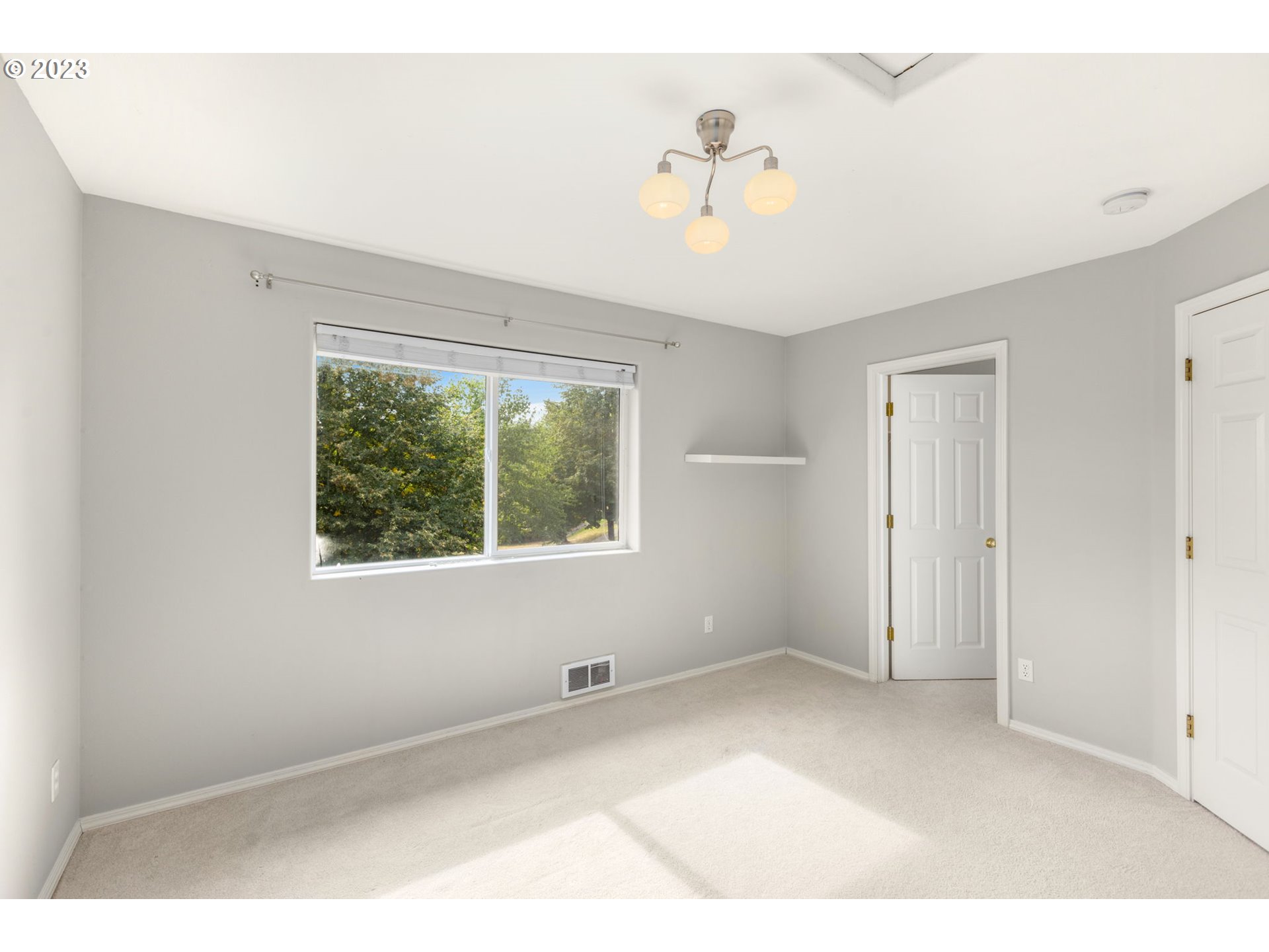 15530 Southwest Peridot Way Beaverton, OR 97007 - Photo 14 of 31 a view of an empty room with a window