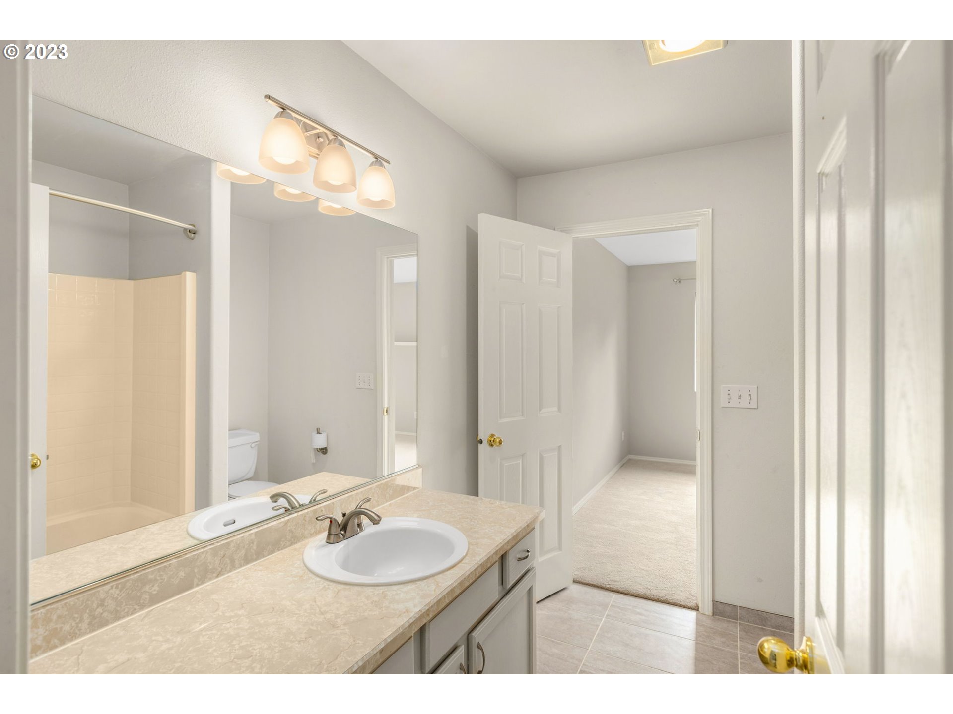 15530 Southwest Peridot Way Beaverton, OR 97007 - Photo 20 of 31 a bathroom with a granite countertop sink and a mirror