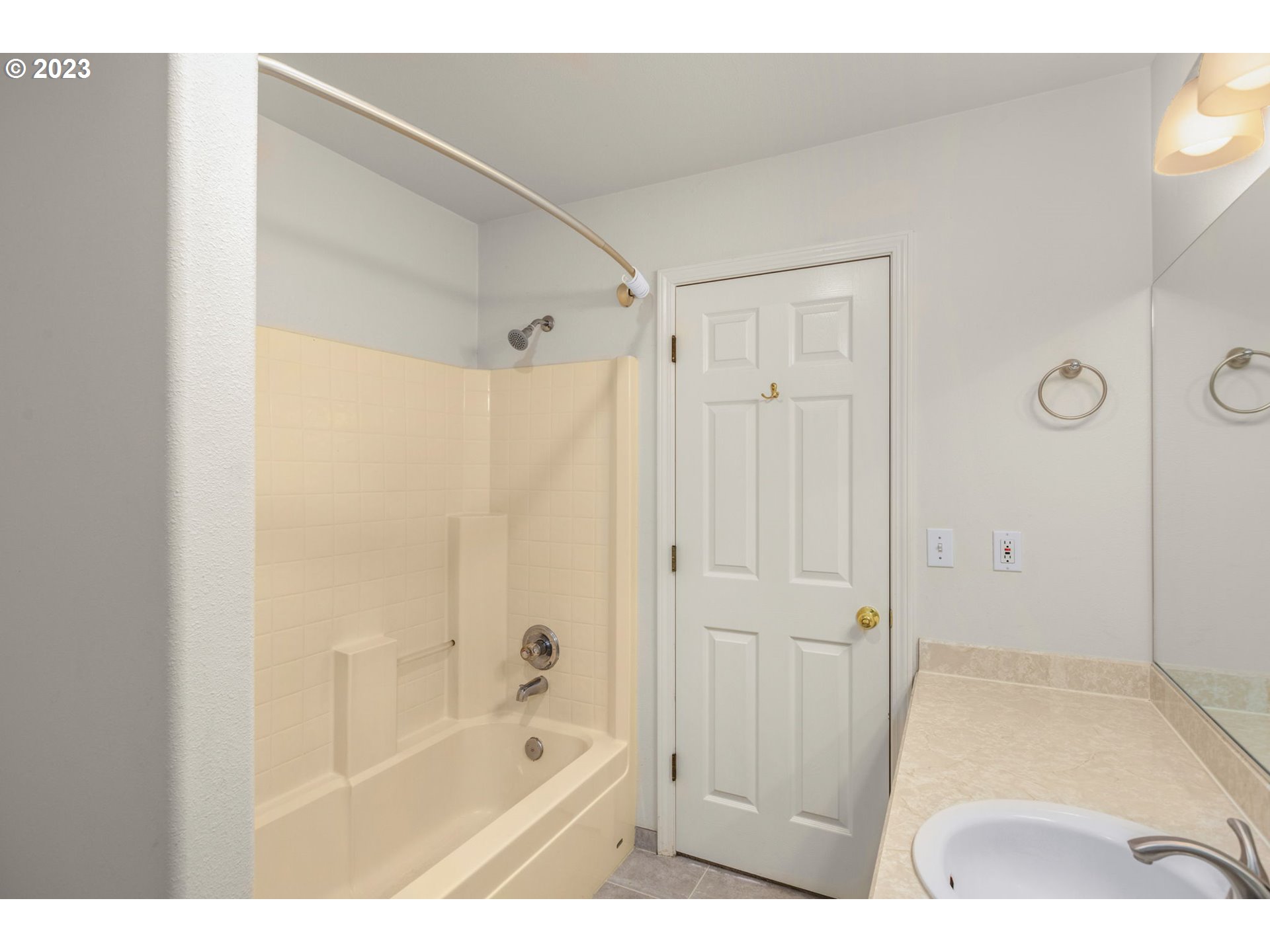 15530 Southwest Peridot Way Beaverton, OR 97007 - Photo 21 of 31 a bathroom with a shower and a tub