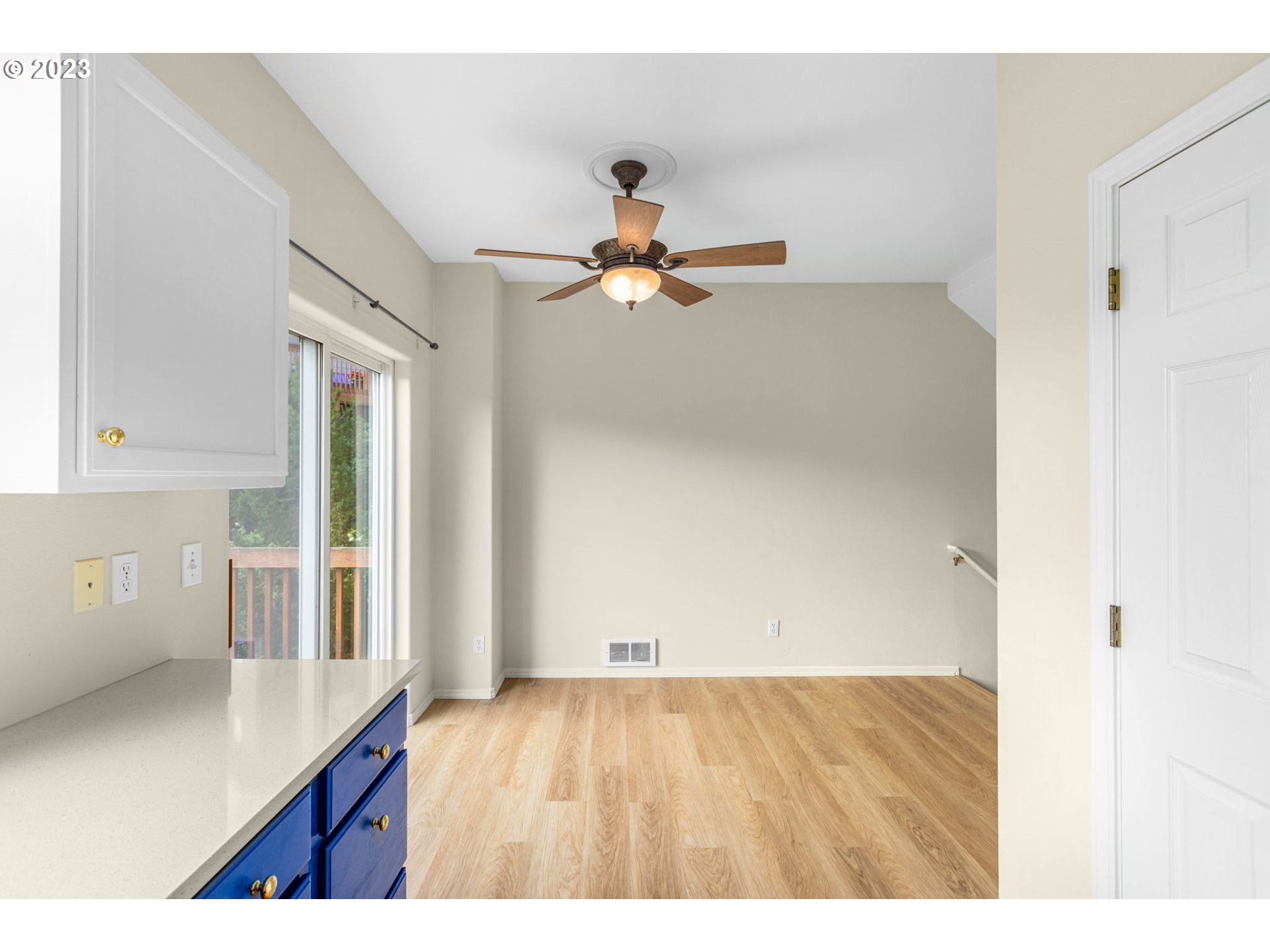 15530 Southwest Peridot Way Beaverton, OR 97007 - Photo 4 of 31 a picture of a room with wooden floor and a ceiling fan