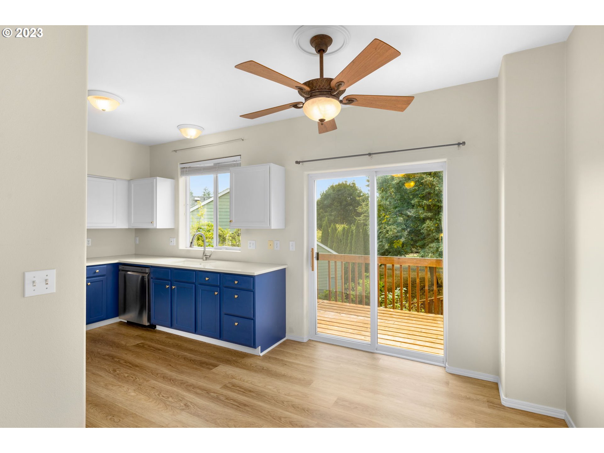 15530 Southwest Peridot Way Beaverton, OR 97007 - Photo 5 of 31 a view of kitchen with furniture a ceiling fan and window