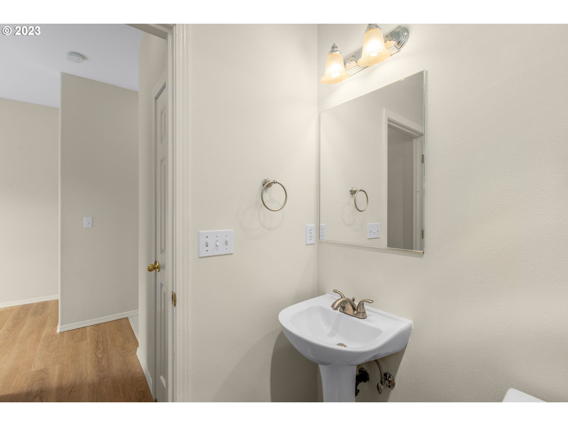 15530 Southwest Peridot Way Beaverton, OR 97007 - Photo 10 of 31 a bathroom with a sink mirror and a shower