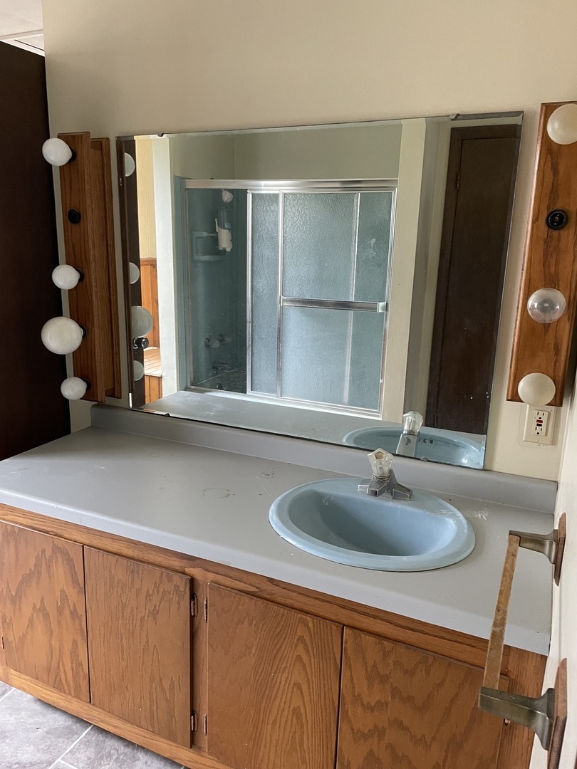 26644 Avers Road Sterling, IL 61081 - Photo 13 of 19 a bathroom with a sink and a mirror