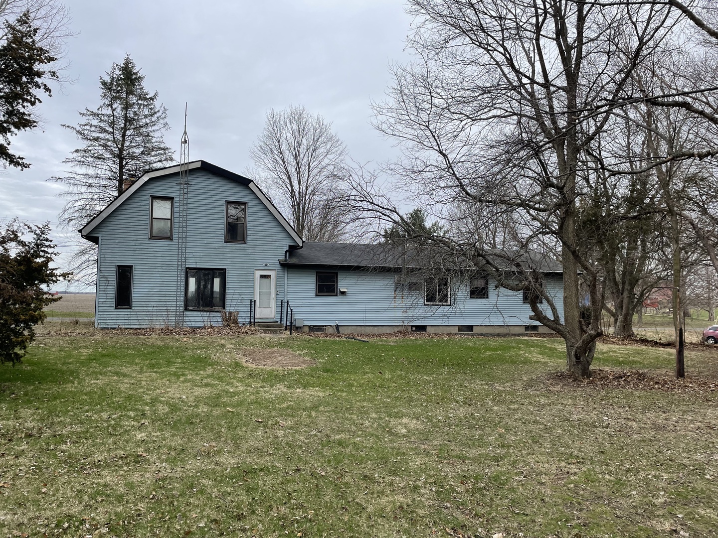 26644 Avers Road Sterling, IL 61081 - Photo 2 of 19 a front view of a house with a yard