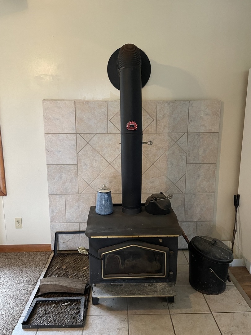 26644 Avers Road Sterling, IL 61081 - Photo 9 of 19 a stove top oven sitting inside of a kitchen