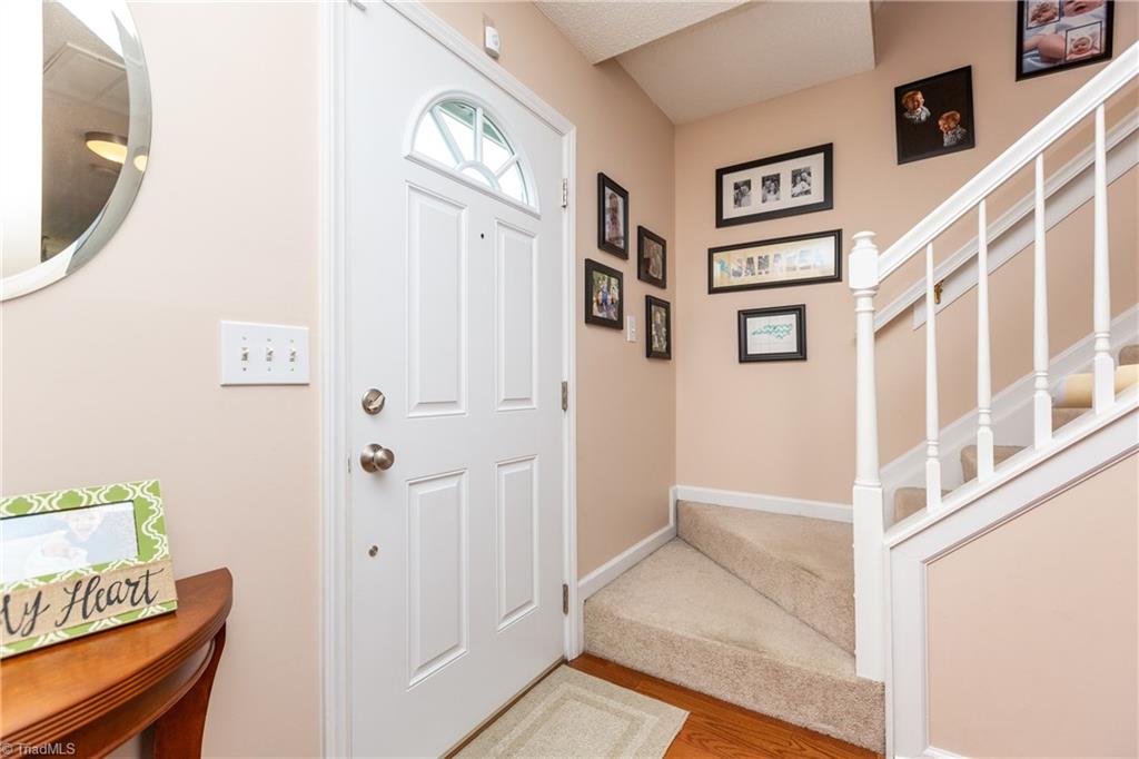 3310 Timberwolf Avenue High Point, NC 27265 - Photo 13 of 24 DAYLIGHT FRONT DOOR WITH TOP OF THE LINE STORM DOOR