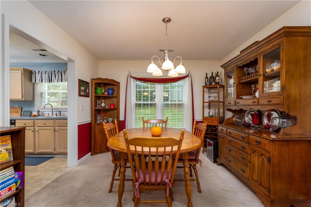 3310 Timberwolf Avenue High Point, NC 27265 - Photo 6 of 24 DINING ROOM OPEN TO KITCHEN