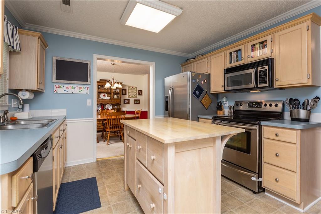 3310 Timberwolf Avenue High Point, NC 27265 - Photo 9 of 24 BRIGHT KITCHEN AREA ADJACENT TO DINING ROOM
