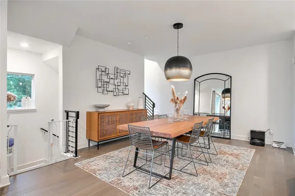 a view of a dining room with furniture window and wooden floor