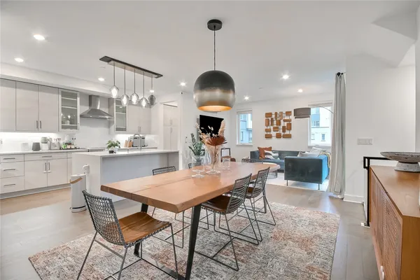 a dining room with furniture and window